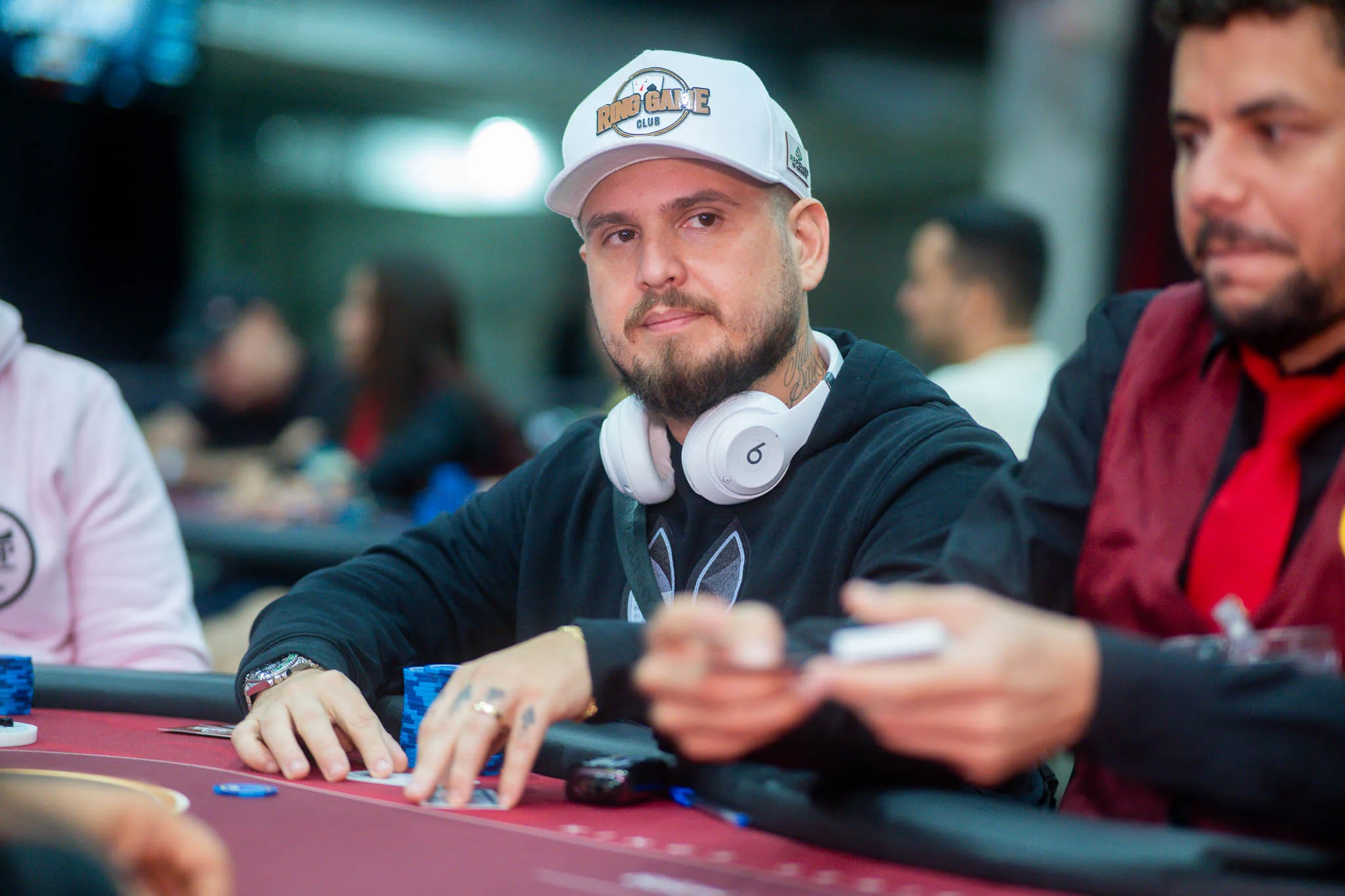 Alexsandro Nogueira at a poker table after winning a significant pot