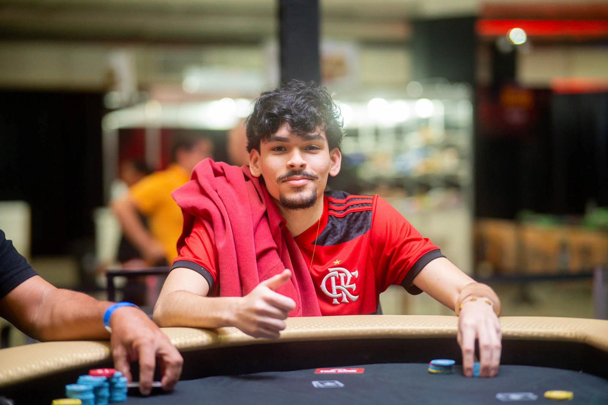 Poker chips and cards on a poker table during a tournament, symbolizing the tension of bubble play.
