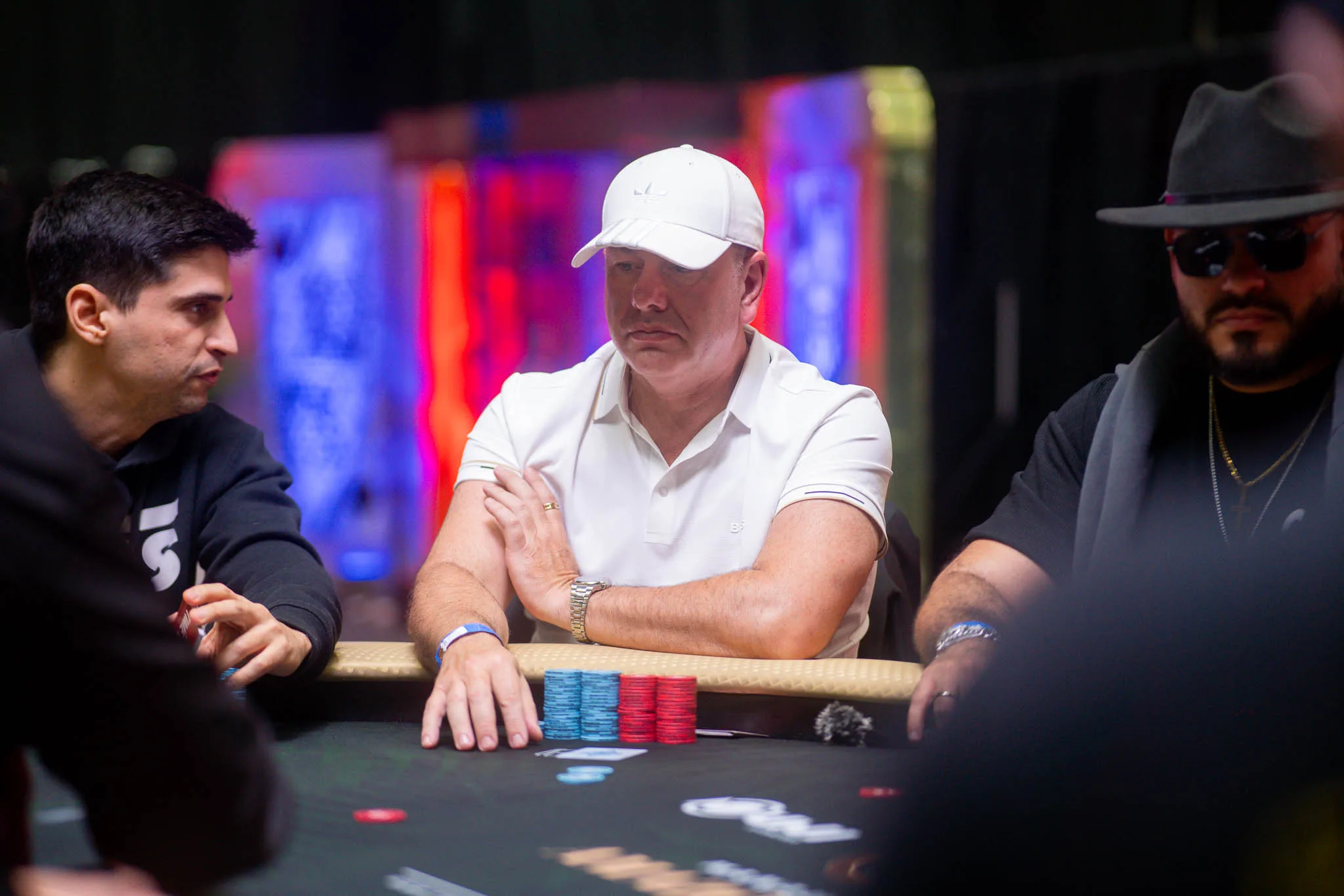 Leandro Pilla at a poker table with chips and cards, focused during a tournament