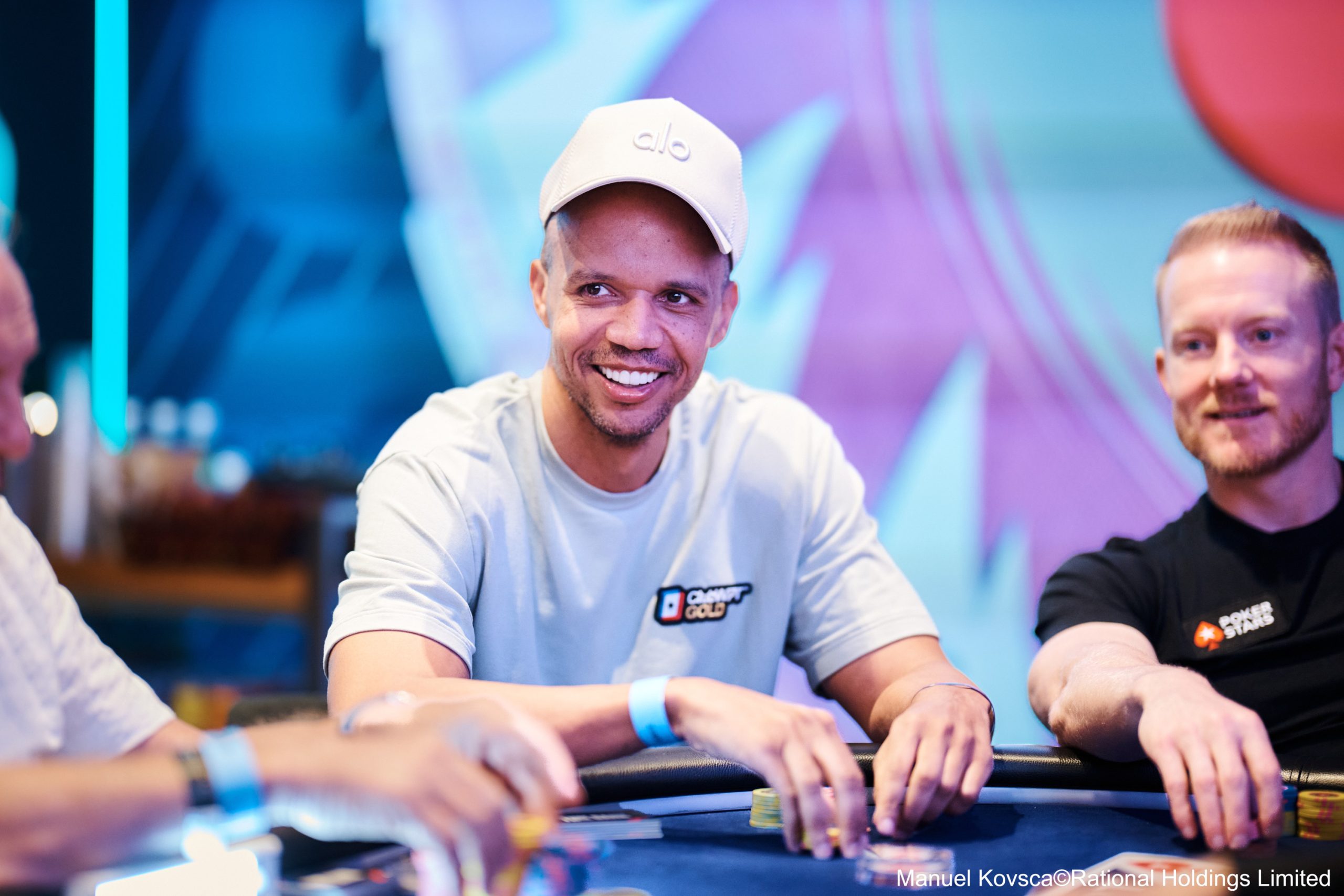 Phil Ivey intently looking at his cards during a World Series of Poker event