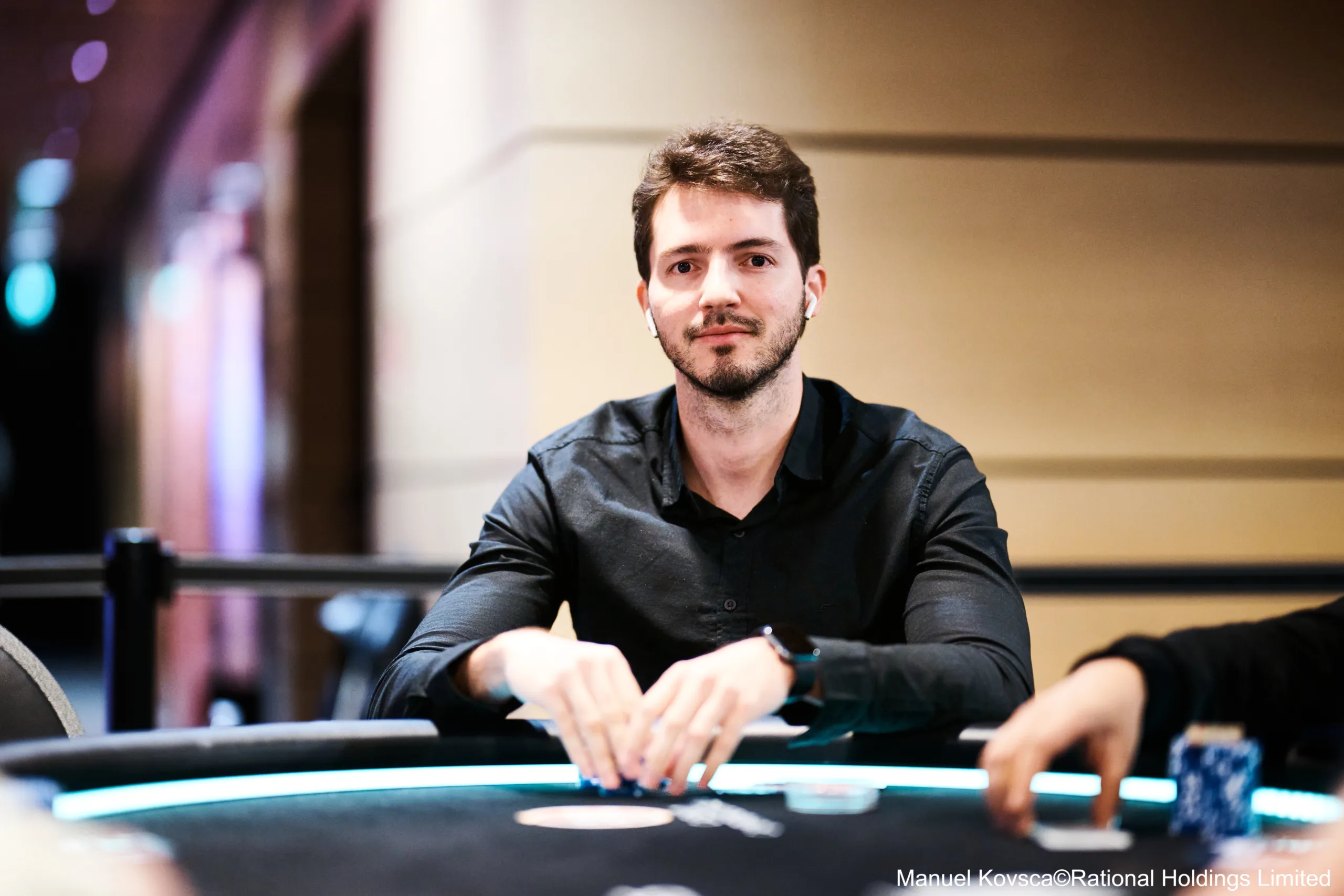 Poker table with chips and cards at a GGPoker GGMillion$ High Rollers tournament