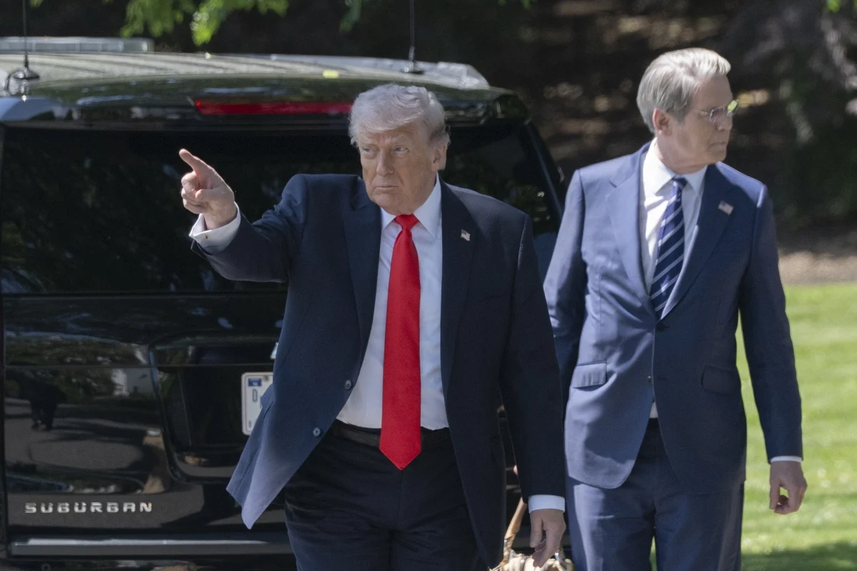 Former President Donald Trump gestures while speaking at a public event.
