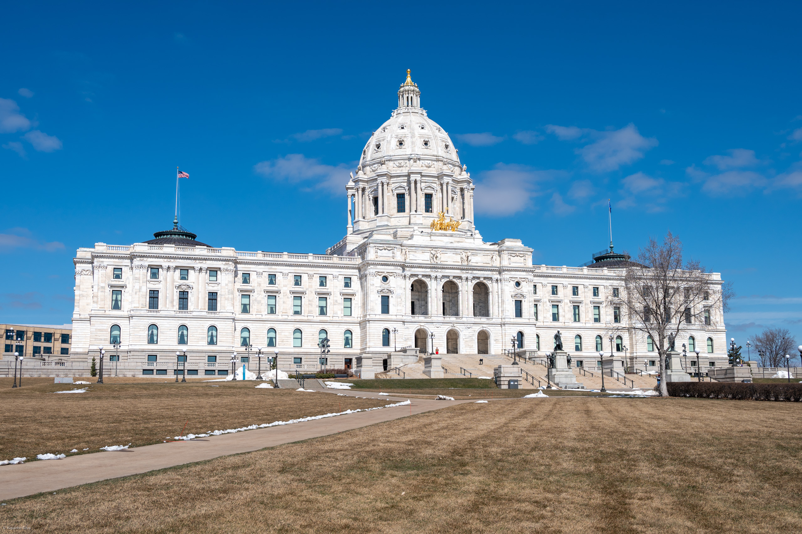 The Minnesota State Capitol building under a clear sky