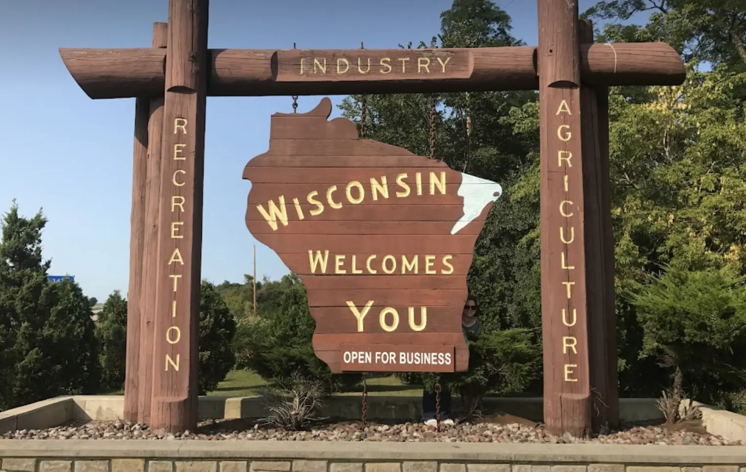 Wisconsin State Capitol building with a graphic overlay representing prediction market data and a legal document