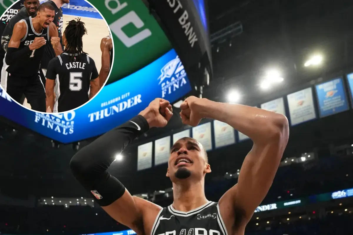 Victor Wembanyama embraces teammates with his head in his hands, celebrating the Spurs' Game 7 win and NBA Finals qualification.