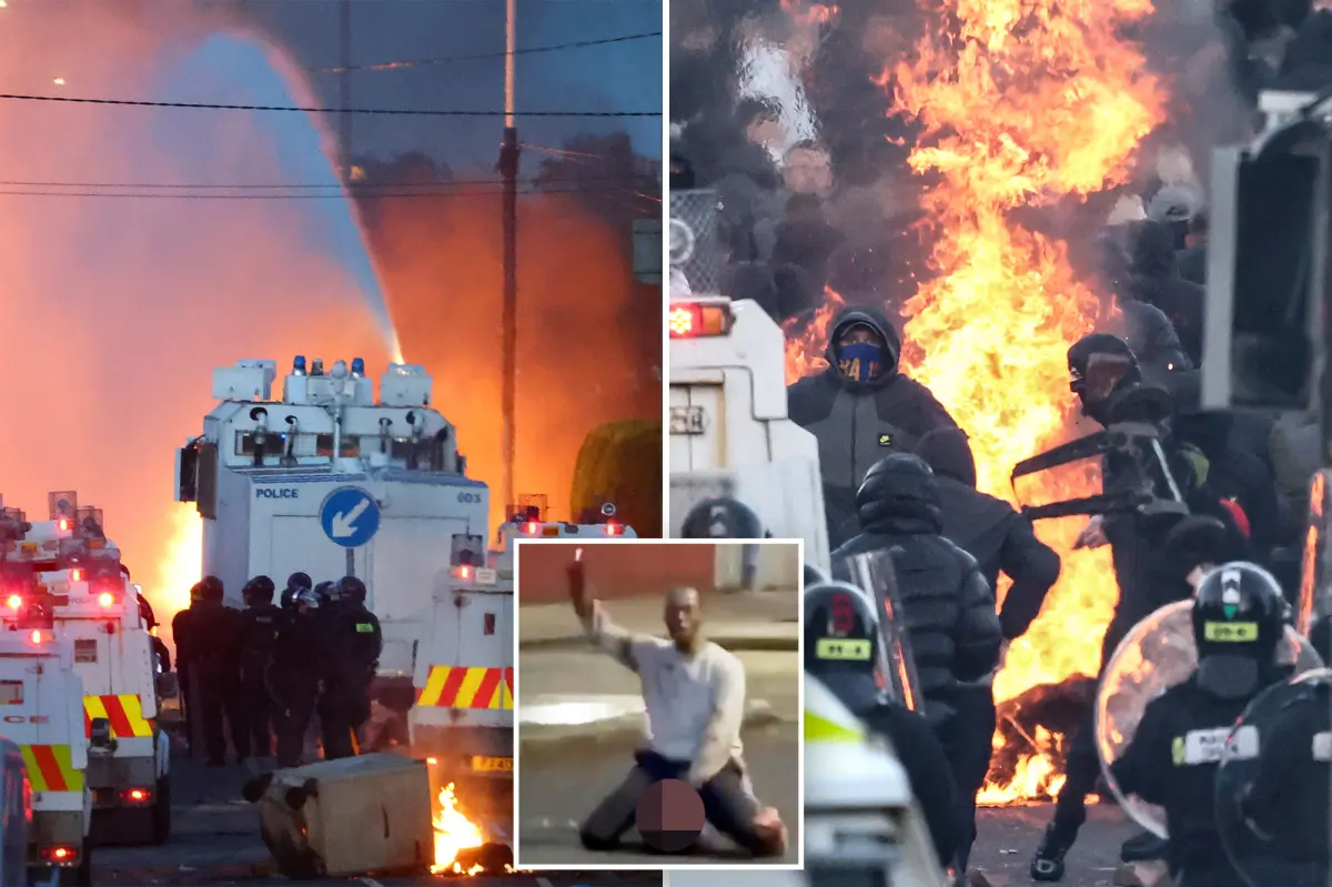 Riot police use water cannons on protesters in Belfast amidst unrest.