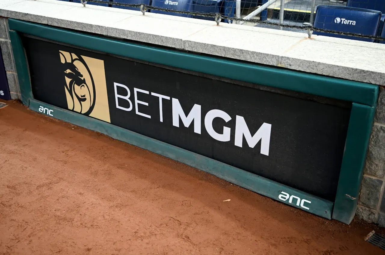 Logos of MGM Resorts, BetMGM, and Major League Baseball signifying their extended partnership.
