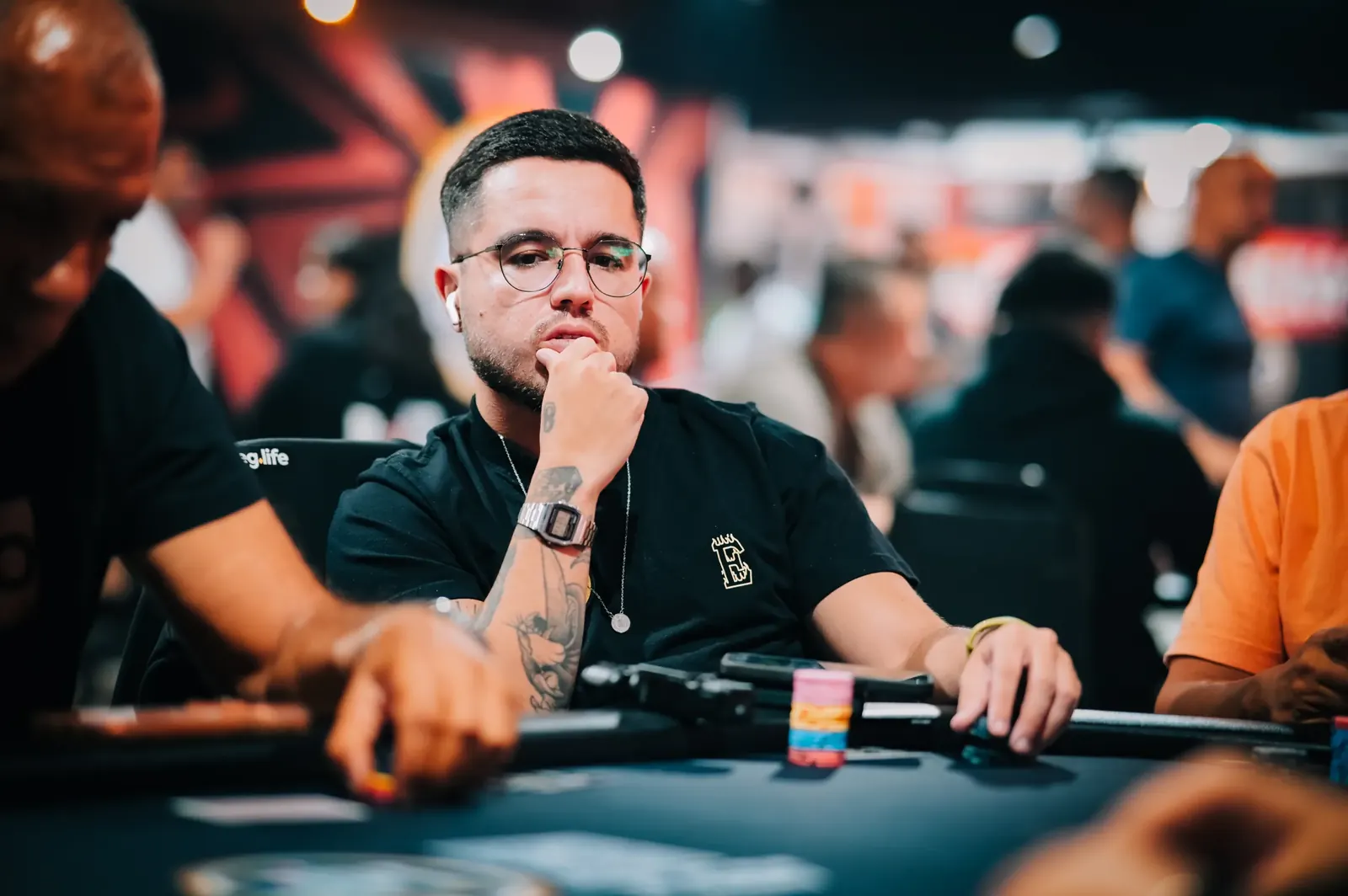 Brazilian poker player Thales Morelli at a World Series of Poker tournament table.