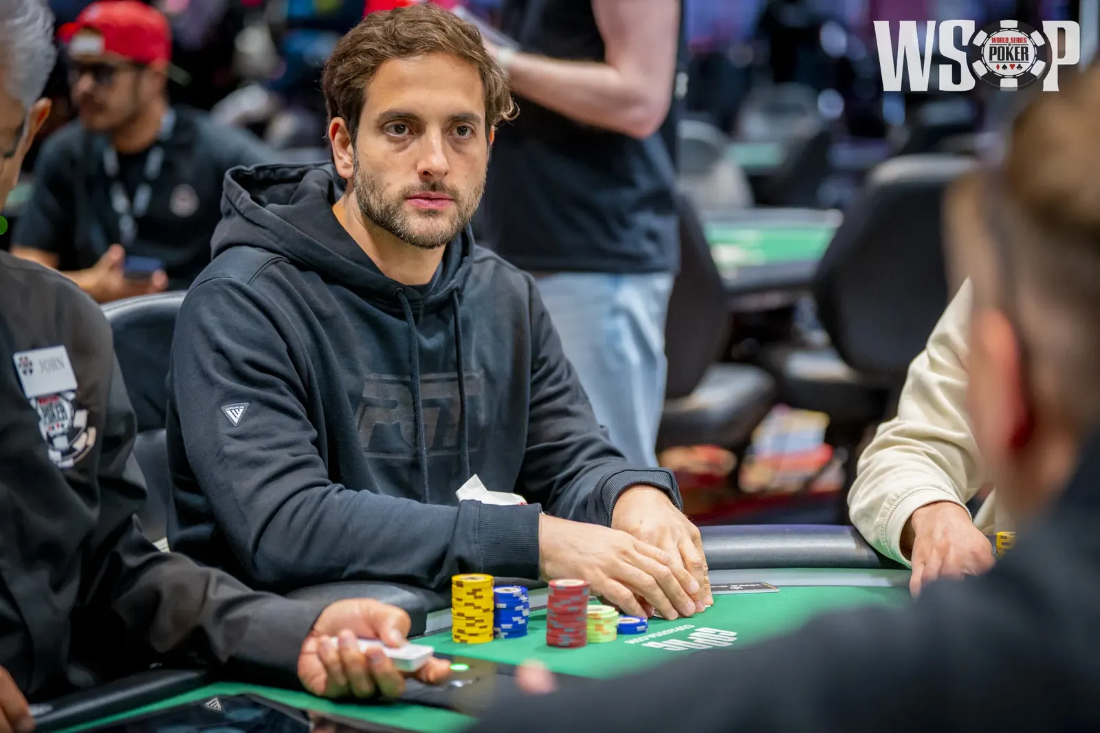 Brazilian poker player João Simão focused during a World Series of Poker tournament.