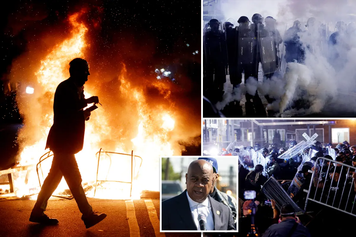 Barricades being lifted by police as protesters gather outside Delaney Hall in Newark, New Jersey.