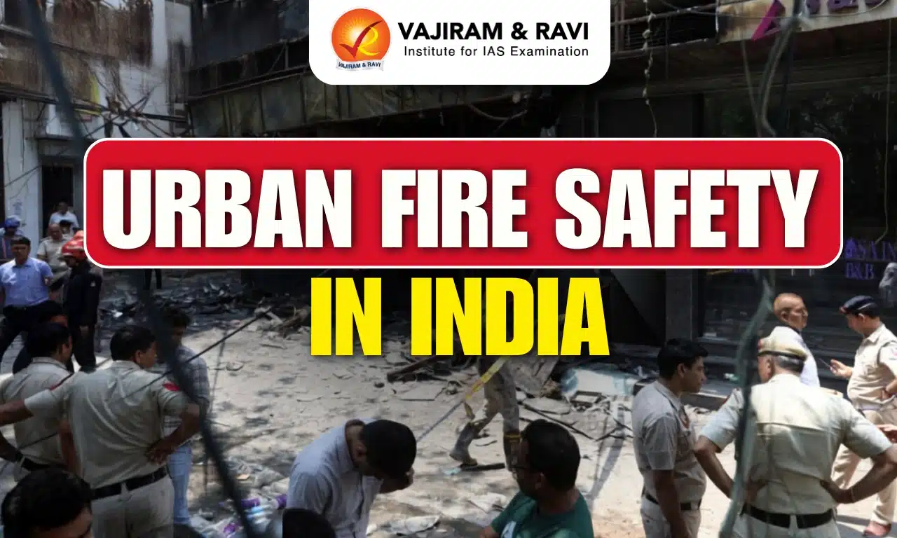 Firefighters working to extinguish a fire in a crowded Indian city street.