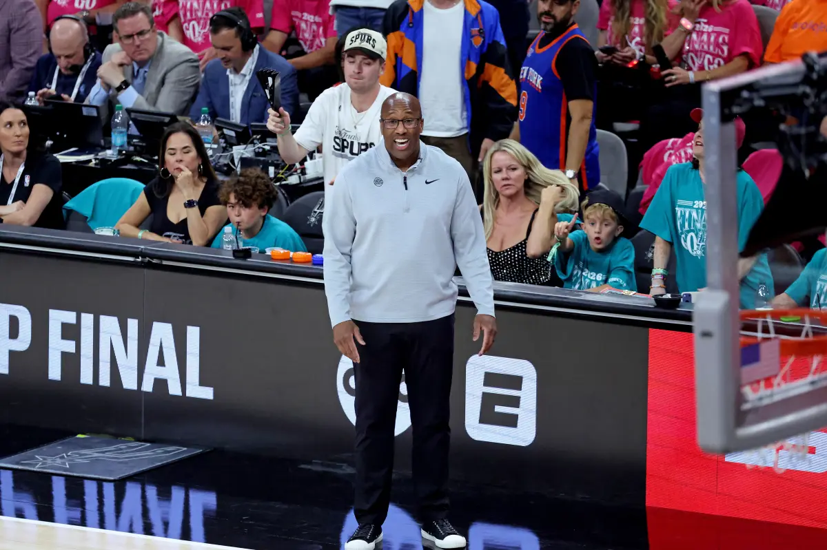 Basketball players competing during an NBA Finals game.