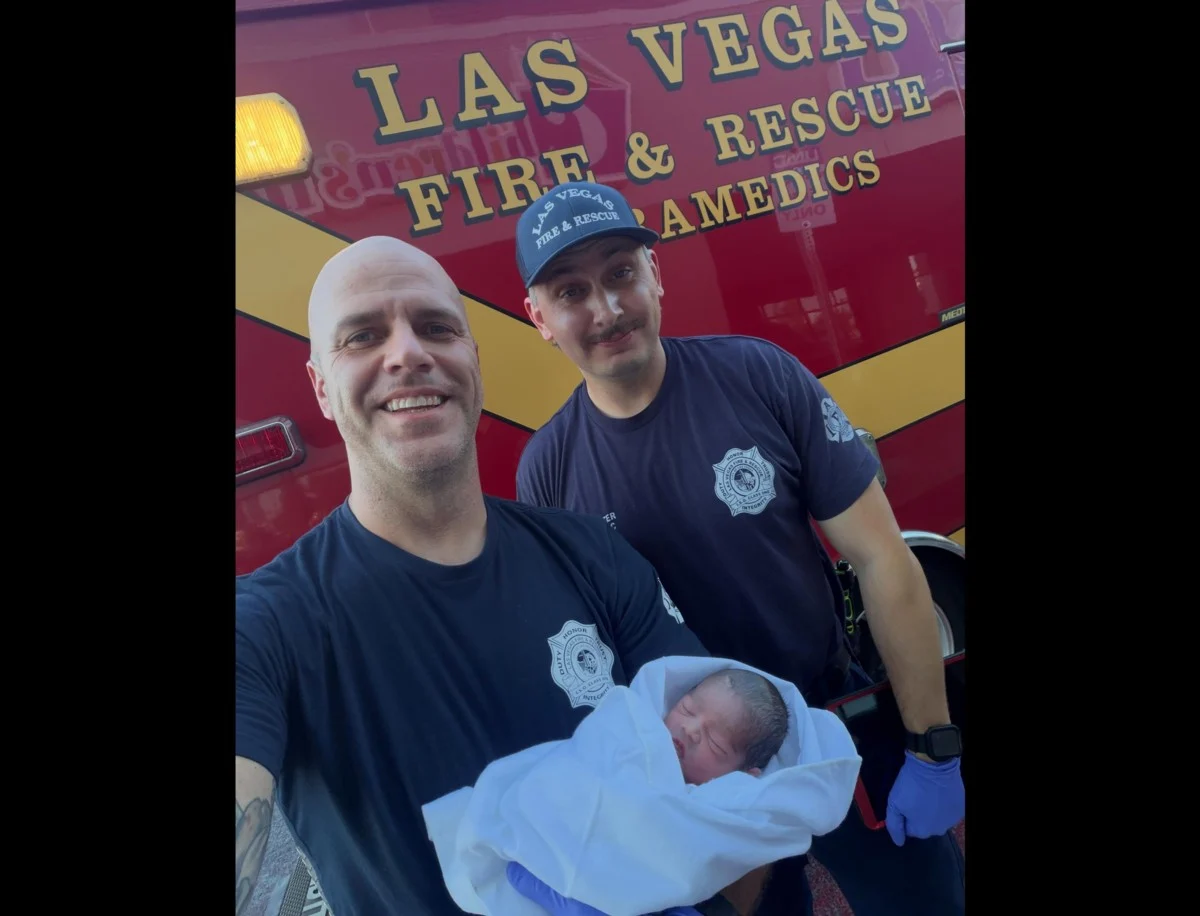 Las Vegas firefighters attending to a woman giving birth in an underground flood control tunnel.