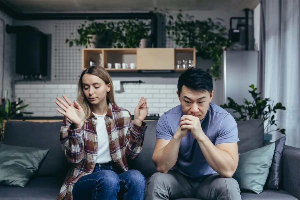 Illustration of a couple discussing relationship problems, representing a Dear Abby advice column scenario.