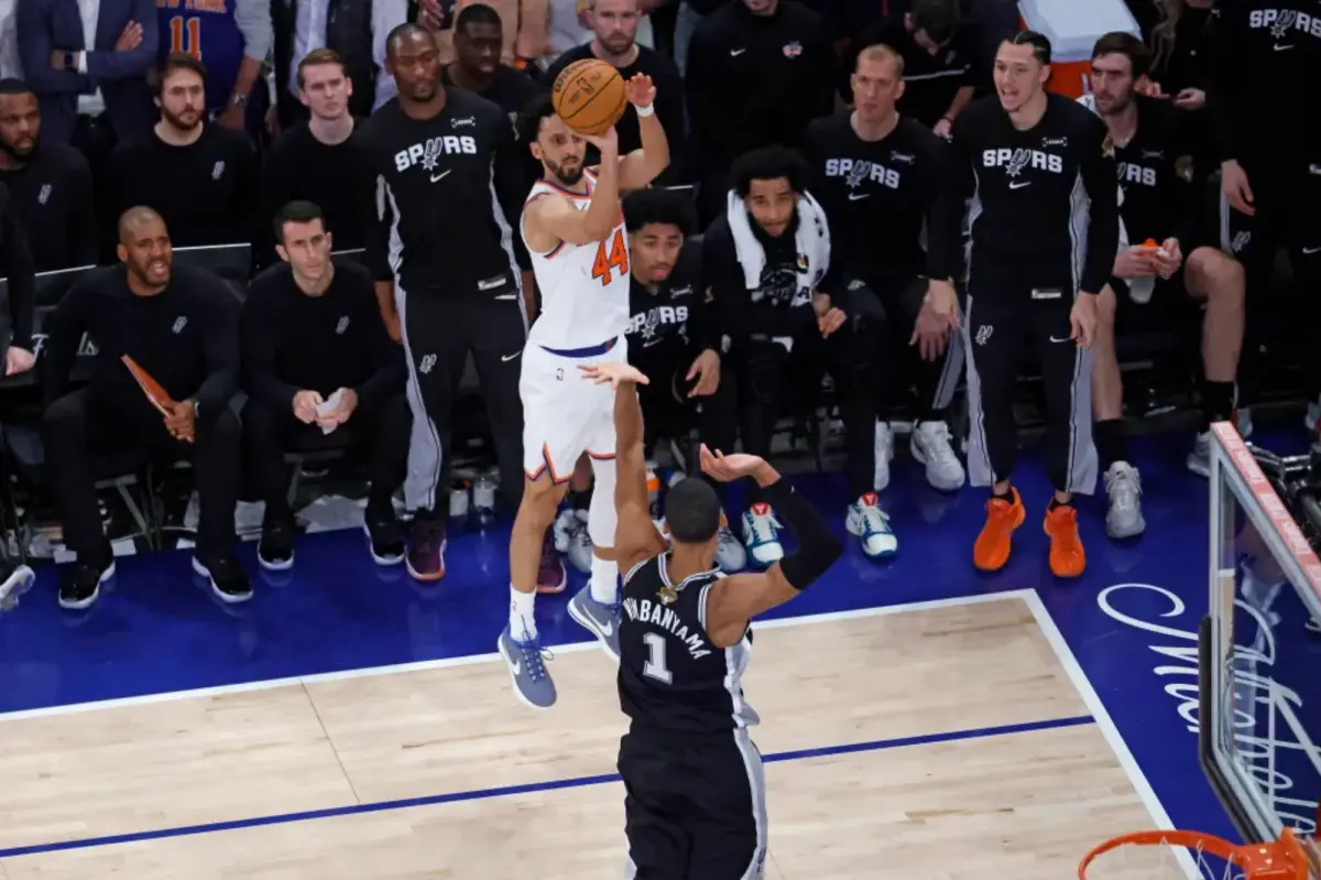 Landry Shamet in action during an NBA Finals game, attempting a shot.