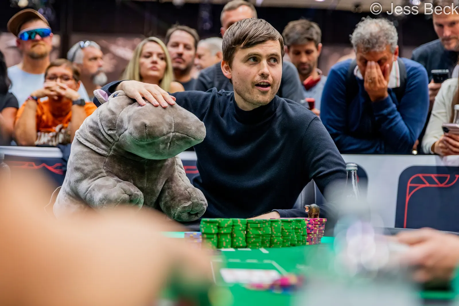Martin Kabrhel in action at a World Series of Poker event, focused on his cards.