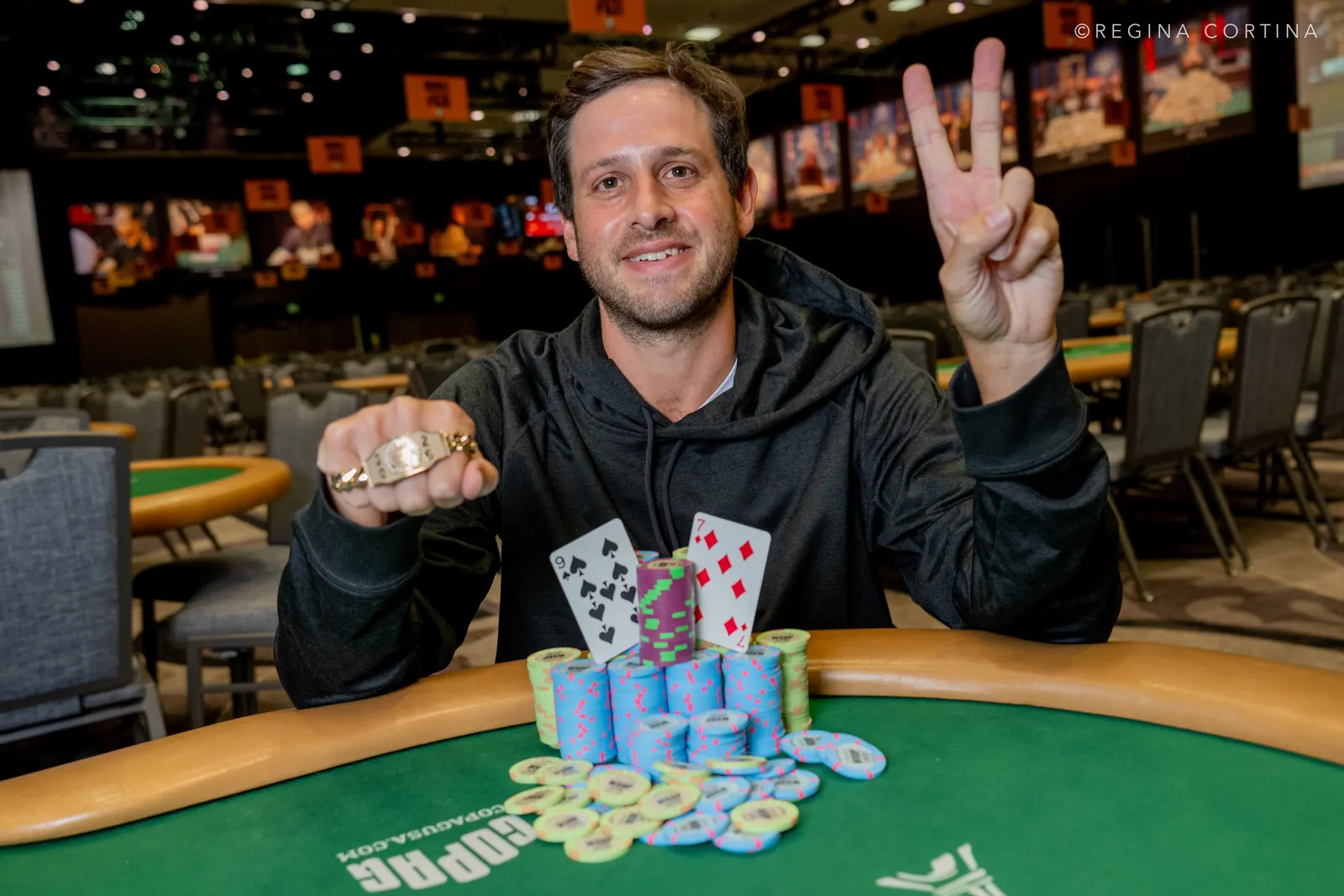 Darren Rabinowitz celebrates winning his second World Series of Poker bracelet, with Phil Hellmuth visible in the background.