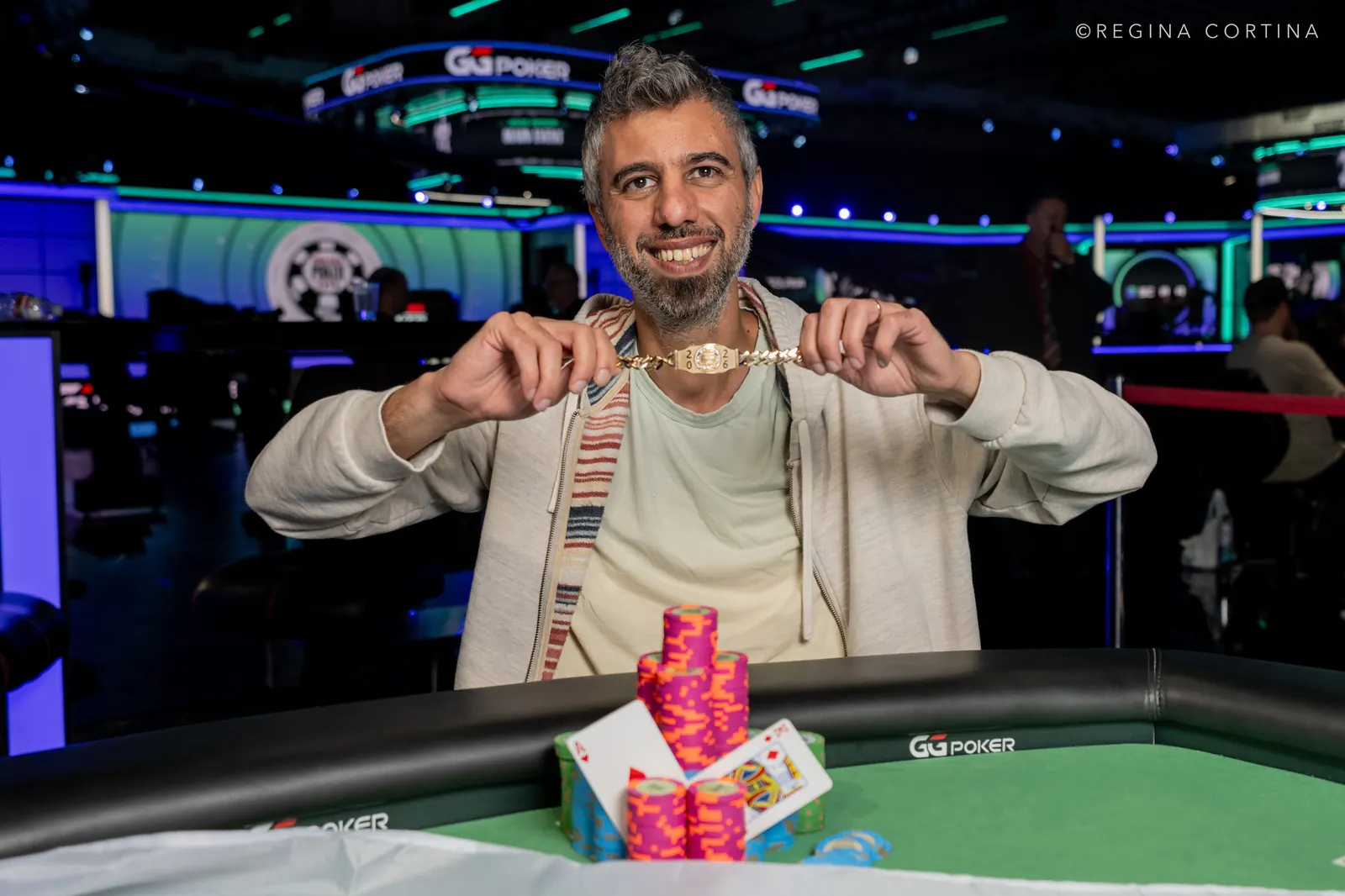 Asi Moshe, winner of the WSOP $3,000 Freezeout, holds up his fifth World Series of Poker bracelet.