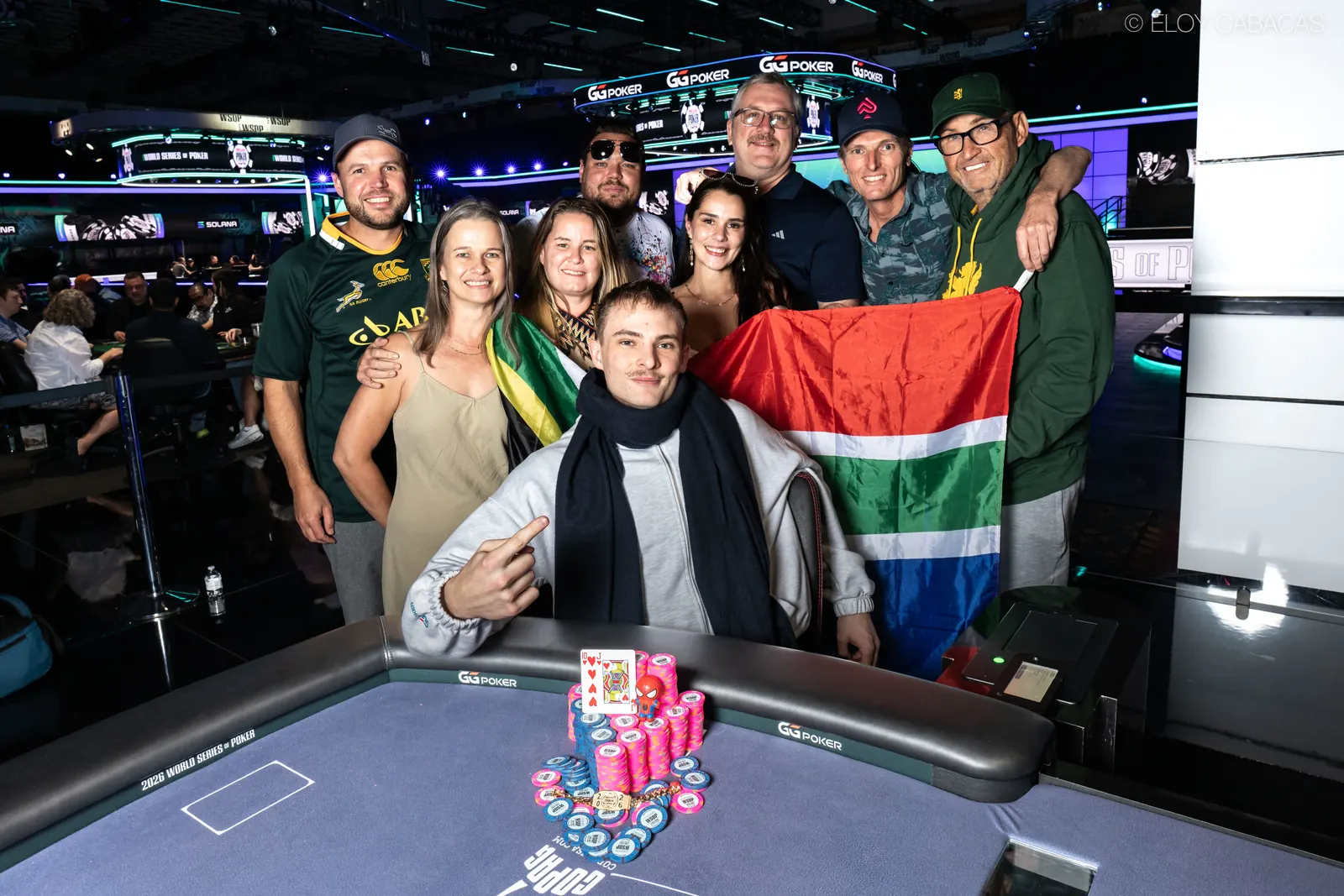 Adriaan Jacobs, winner of WSOP Event #78, smiles while holding his gold bracelet.