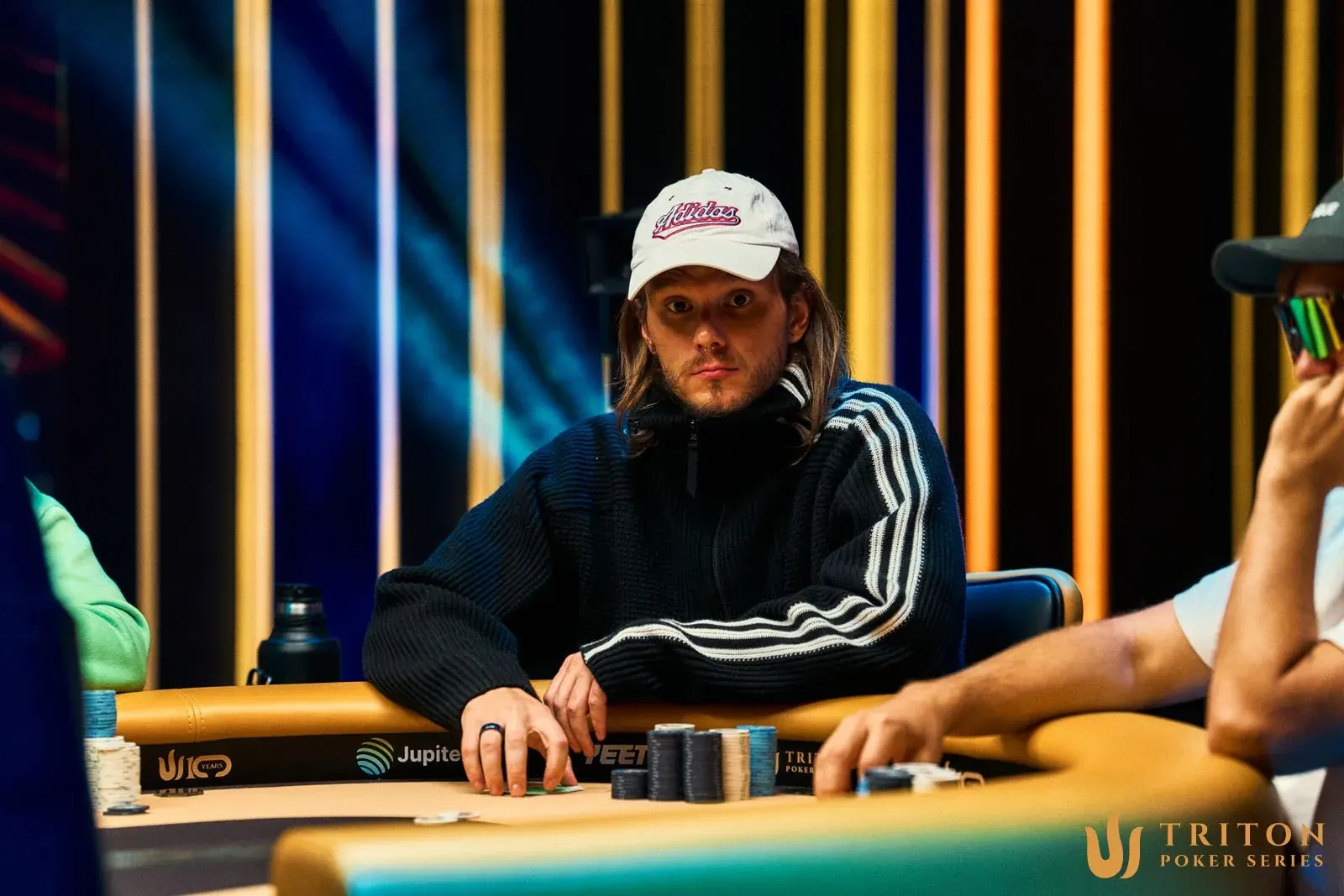 A graphic displaying poker chips and flags, with "GGMillion$ High Rollers Final Table" prominently featured. Four Brazilian flags are visible.