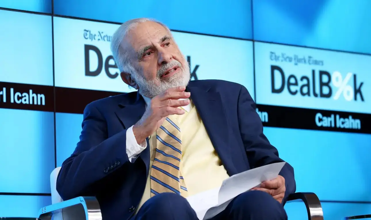 Image depicting Carl Icahn and the Caesars Entertainment logo, symbolizing a potential acquisition.