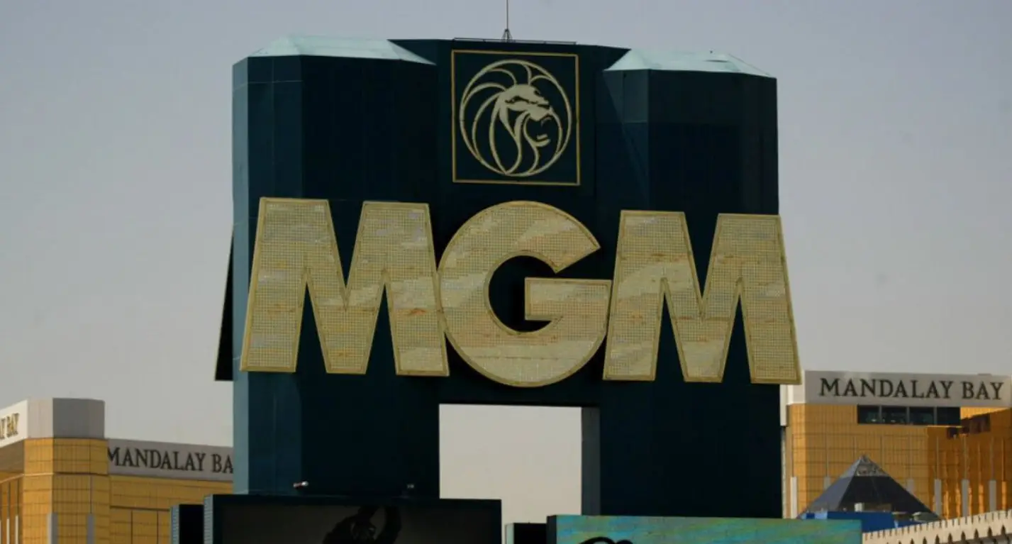 A split image showing the MGM Resorts International logo and a portrait of Barry Diller.