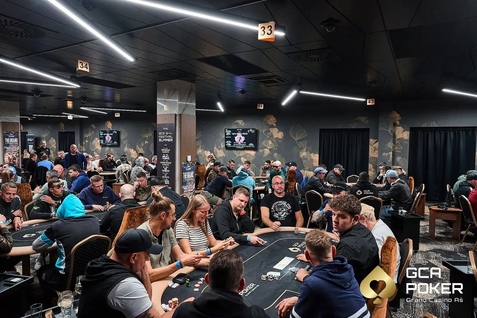 A poker table in a casino with chips and cards.