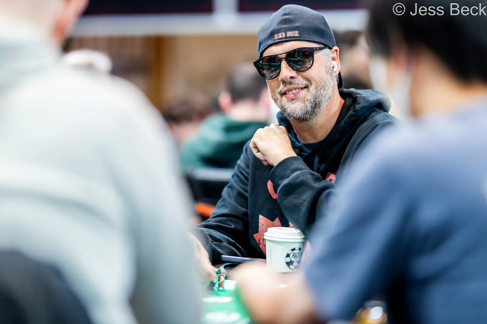 Brad Booth, a recognizable figure in poker, is seen at a poker table during a World Series of Poker event.