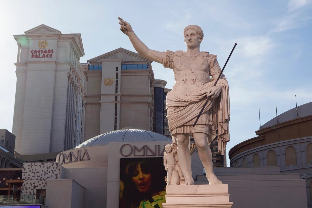 Caesars Palace Las Vegas entrance with illuminated fountains and Roman columns at night