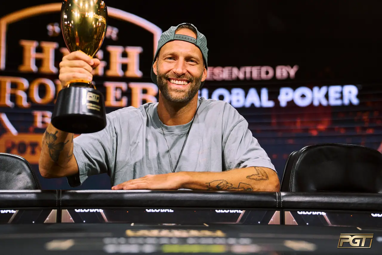 Jonas Kronwitter poses with the PGT PLO Series championship trophy at the PokerGO studios in Aria, Las Vegas