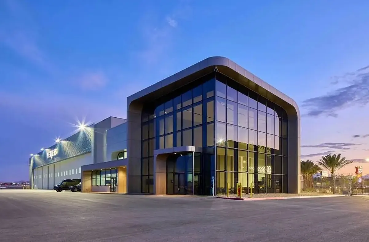 NetJets private terminal building at Harry Reid International Airport in Las Vegas, with a Gulfstream jet parked on the ramp